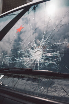 Close up shot of a broken windshield