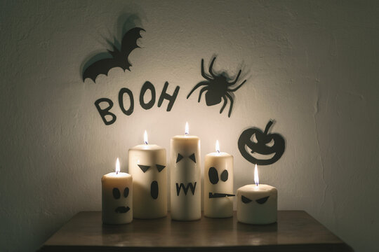 Diy halloween decoration made by funny candle ghosts.