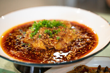 cold boiled pork with garlic puree, a traditional Sichuan cuisine dish in China, with Sichuan red pepper sauce.