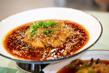 cold boiled pork with garlic puree, a traditional Sichuan cuisine dish in China, with Sichuan red pepper sauce.