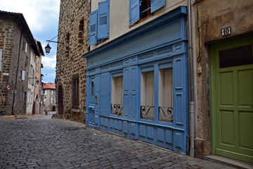 Le Puy-en-Velay, France - April 19th 2019 : Focus on a facade, probably an ancient shop transformed in a flat, due to a decline of the commercial activity of the city.