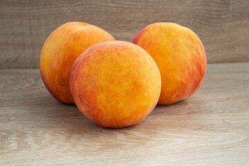 Ripe peaches on a white background and a tree background