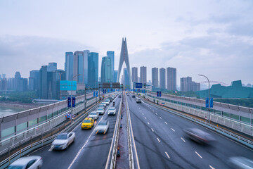 The traffic on qiansimen bridge, with the financial district in Chongqing, China, on a cloudy day.