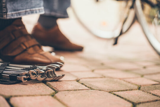 Real reparing of bicycle in the court pavement