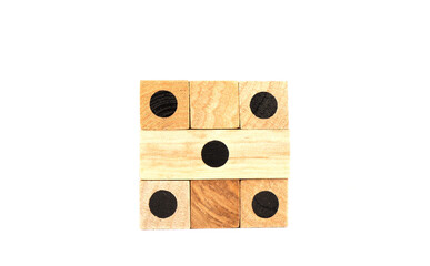 Wooden puzzle dice isolated on white background.
