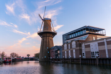 Fototapeta na wymiar Twilight after sunset shot in Schiedam, Netherlands is famous for its windmills which are the highest in the world and also Jenever, a type of gin