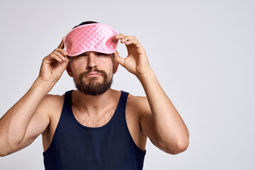 A man in a black t-shirt mask for sleep calm relaxation lifestyle