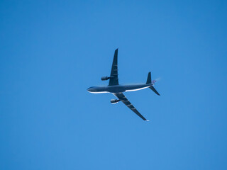 Aeroplane flying high above Sydney Harbour Australia
