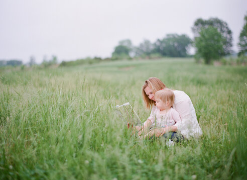 Mother and daughter reading a book together