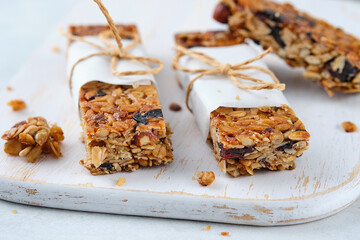 Homemade granola bars with nuts, seeds, chia seeds and dried cherries.