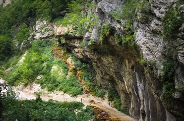 An hiking path in a gorge among the rocks in the Sibillini mountains (Marche, Italy, Europe)