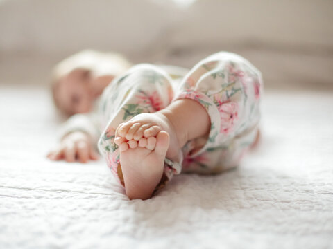 Baby playing with her feet