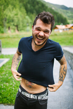 Portrait of a tattooed man outdoors