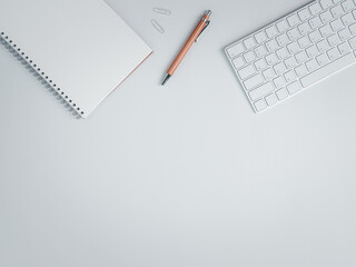 Top view of work space with brown pen and keyboard