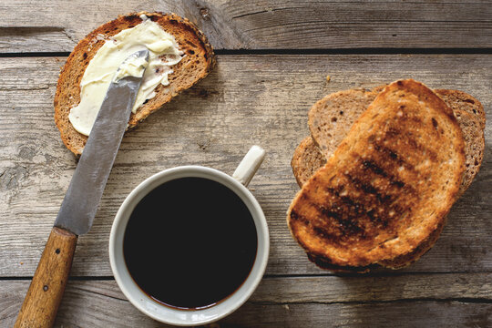 Food: simple breakfast with toasts, butter and coffee