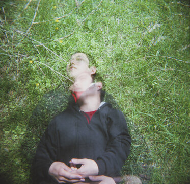 Lying in the grass (multiple exposure)