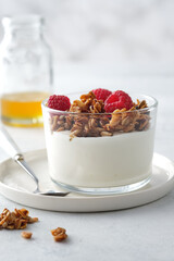 Diet dessert with yogurt, granola and fresh berries.