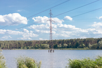High-voltage tower in the middle of a wide lake