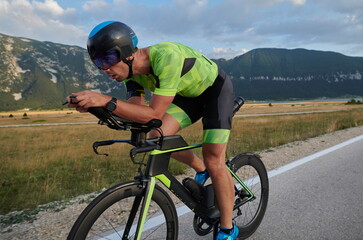 Fototapeta premium triathlon athlete riding bike