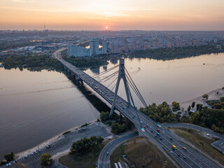 Aerial drone view. Automobile North Bridge in Kiev at sunset.