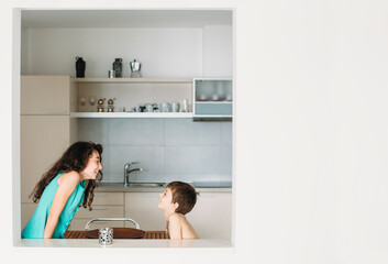 Little brother is playing and provoking his older sister