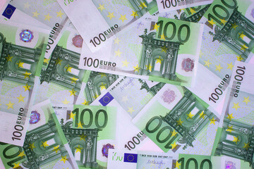 Many one hundred euros notes on the table. 100 euro banknotes