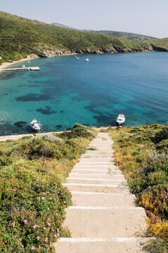 Steps leading down to a beach on Fourni Island, Greece.