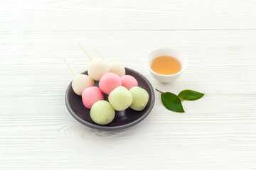 Fototapeta na wymiar Asian cooking background - traditional sweets Dango, dumpling rice cake