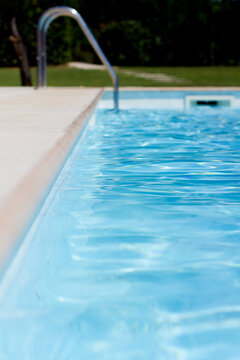 Side view of swimming pool step ladder