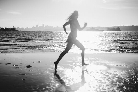 woman running on the beach