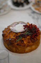 Wedding loaf with salt and a sprig of rowan close up