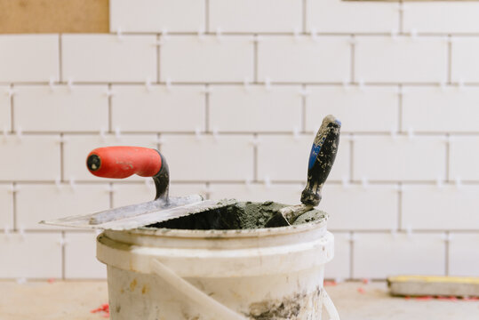 home renovation, bucket and trowel