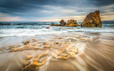 Gold rocks in sea