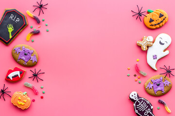 Overhead view of Halloween decorations with cookies and candies, top view