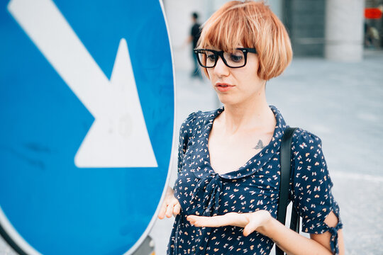 Urban Signal Arrow Is Pointing a Alluring Woman