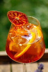 Glass of aperole spritz cocktail with orange slice