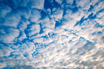 Blue sky background with a tiny clouds