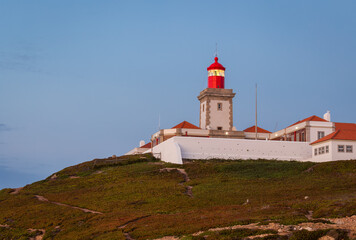 Fototapeta na wymiar Lighthouse at Cape Cabo da Roca near the city of Cascais, Portugal. Cape Roca is the most western point of continental Europe.