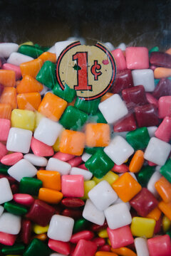 Colorful candies in an old penny gumball machine