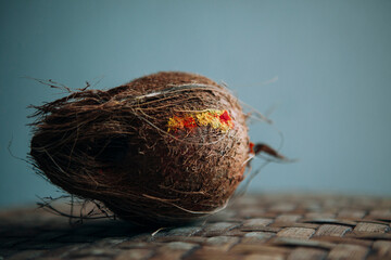 Coconut offered to a temple with tika, a part of hindu religion.