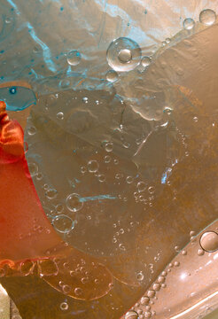 closeup macro of the intricate patterns and texture of fluids intermixing