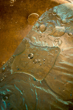 closeup macro of the intricate patterns and texture of fluids intermixing