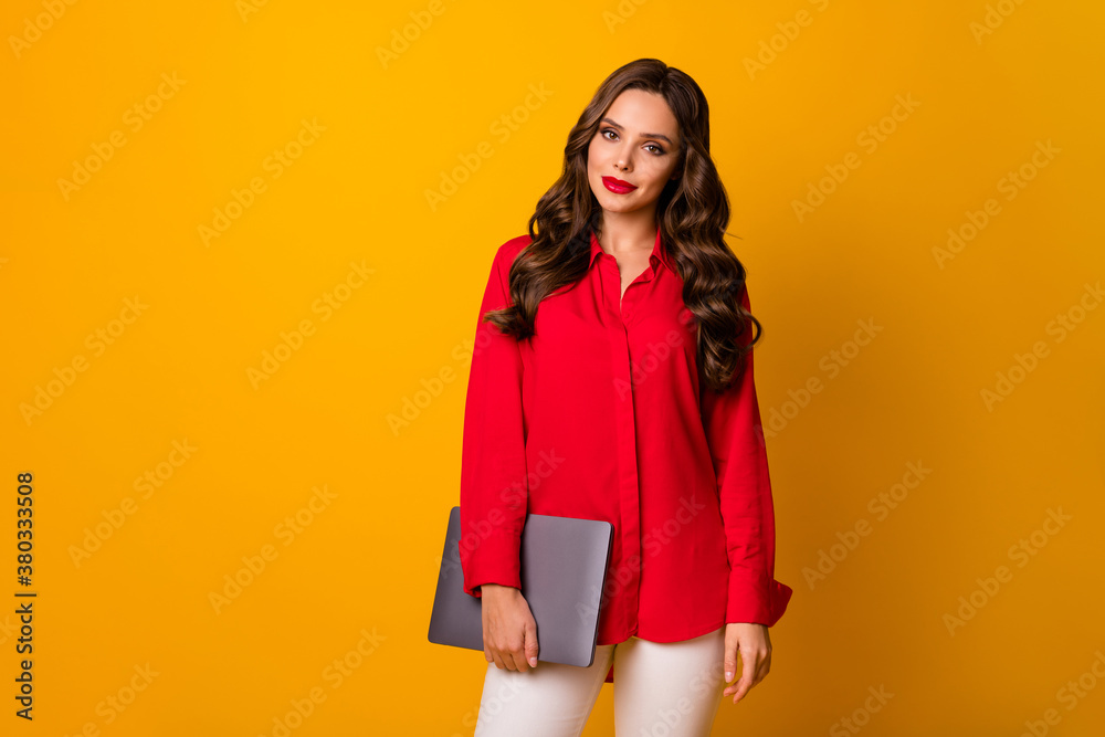 Poster Photo of attractive wavy lady hold closed notebook hands workshop meeting modern technology user wear red office shirt white pants isolated yellow bright color background