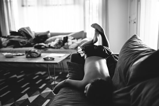 boy plays on the couch