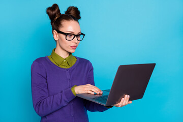 Close-up portrait of her she nice attractive smart clever focused girl holding in hands laptop typing text copywriter isolated on bright vivid shine vibrant blue green teal turquoise color background
