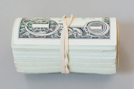 Roll of US one dollar bills