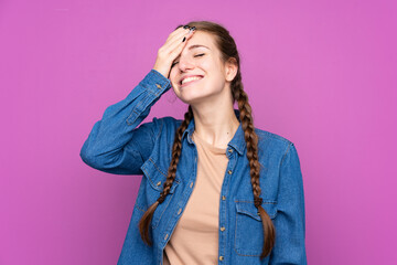 Young woman over isolated purple background