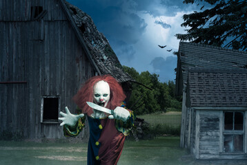 eerie clown with a knife in the hand in front of a scary scene