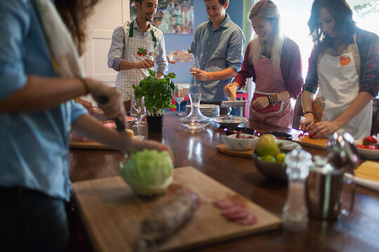 Group of Italian Friends Cooking Together Spaghetti Meal