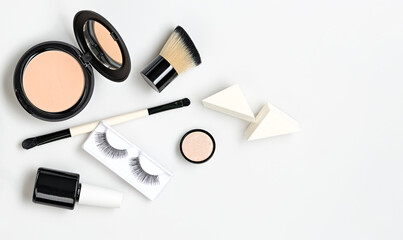 Beauty cosmetics makeup product flying. Woman make up, brushes lipstick falling in air. Creative fashion concept on white. Cosmetology make-up design color set fly, levitation.